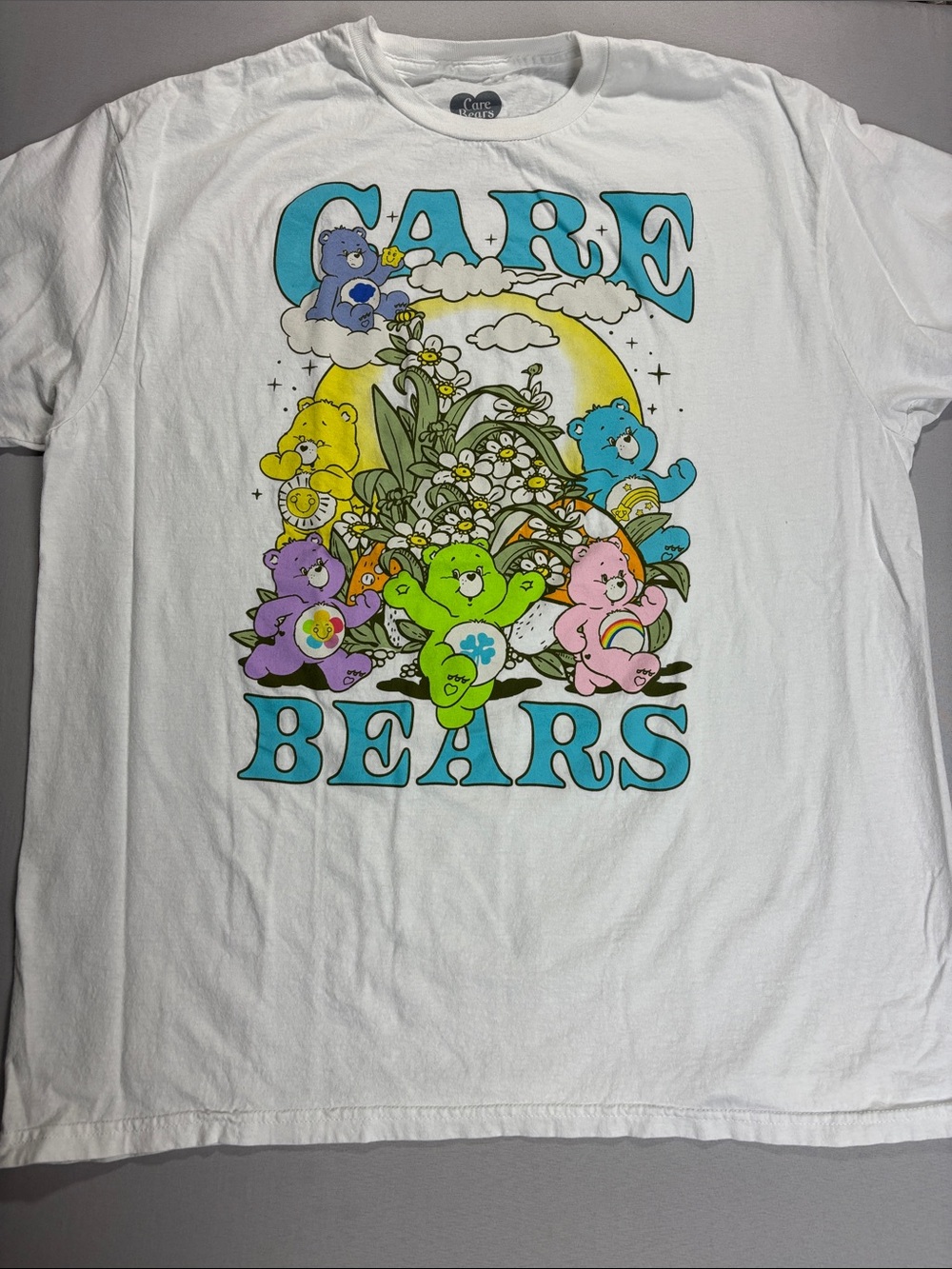 Care Bears White Tee with Multi Color Graphic Characters Women’s XL